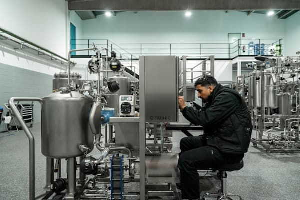 Technician inspecting pump equipment